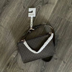 Michael Kors signature chain belt bag. 

Chocolate color - tags still attached.